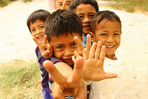 Children flashing peace signs